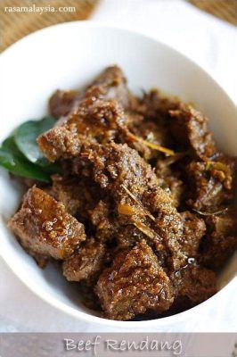  Rendang: Ein schmelzendes Feuerwerk an Gewürzen und einer cremigen Kokosnusssauce!